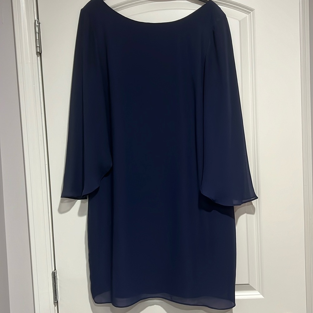 Jennifer Lopez size 8 navy dress with long sleeves.